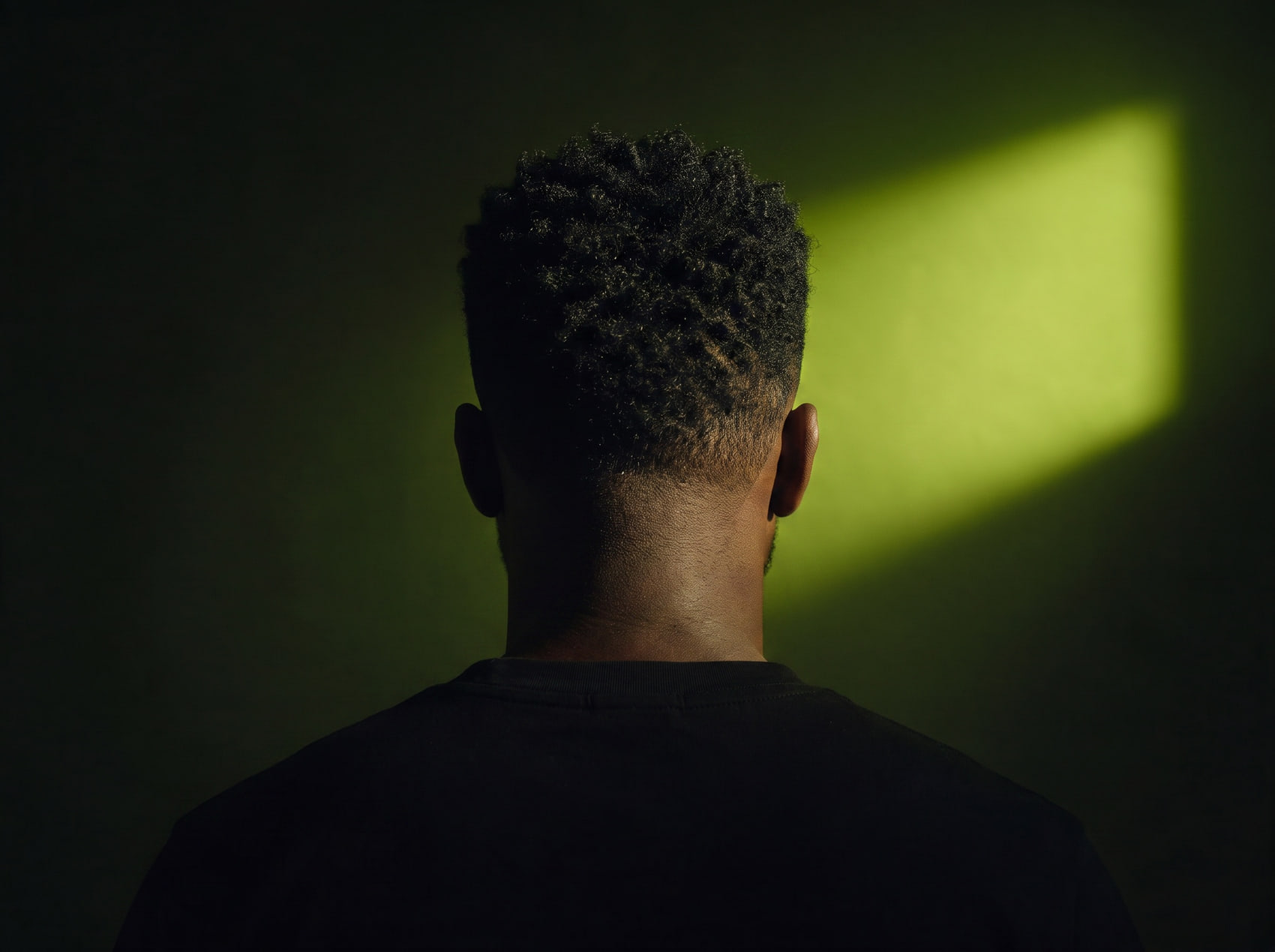 A short taper fade, seen from behind